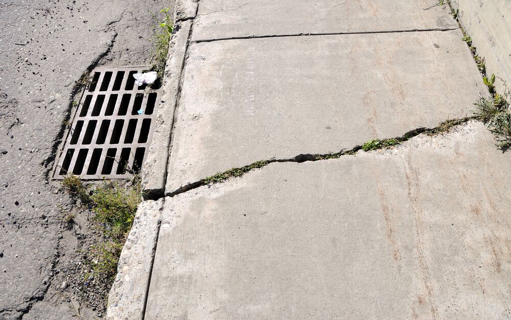 broken sidewalk concrete repair